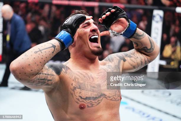 Tom Aspinall of England reacts to defeating Sergei Pavlovich of Russia by TKO in the interim UFC heavyweight championship fight during the UFC 295...