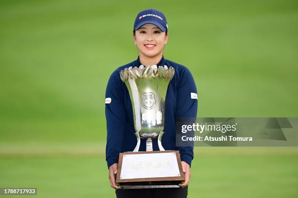 Mao Saigo of Japan poses with the trophy after winning the tournament following the final round of 39th Itoen Ladies Golf Tournament at Great Island...