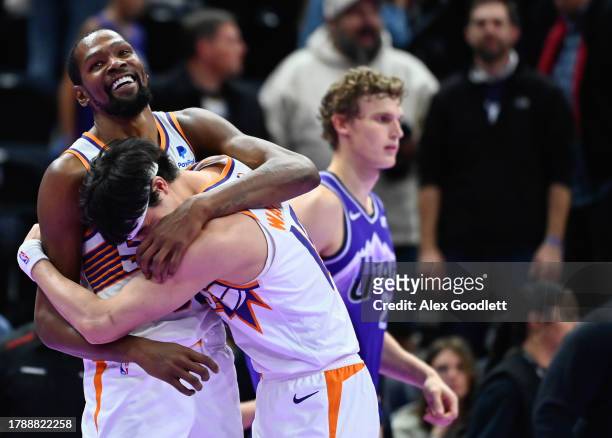 Kevin Durant hugs Yuta Watanabe of the Phoenix Suns after an NBA In-Season Tournament game against the Utah Jazz at Delta Center on November 17, 2023...