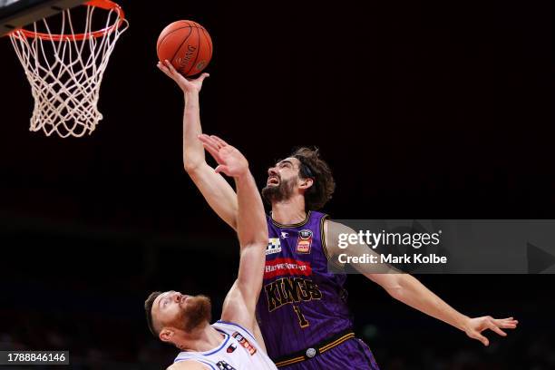 Jordan Hunter of the Kings lays up a shot under pressure from Aron Baynes of the Bullets during the round seven NBL match between Sydney Kings and...