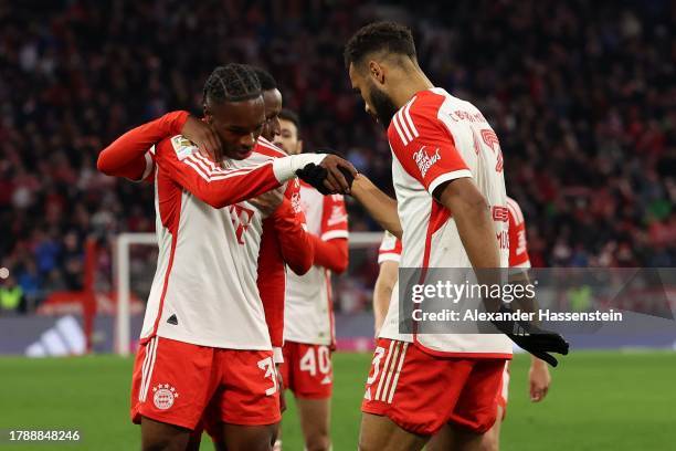 Eric Maxim Choupo-Moting of Bayern Munich celebrates with team mate Mathys Tel after scoring the team's fourth goal during the Bundesliga match...