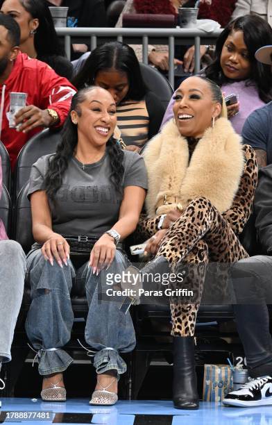 Rachael Jackson and Kimberly Blackwell sit court-side during the game between the Miami Heat and the Atlanta Hawks at State Farm Arena on November...