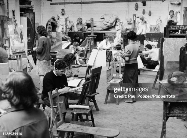 Students working at easels during a still life class, sculptures arranged in the background, at the Royal College of Art, in Kensington, London,...