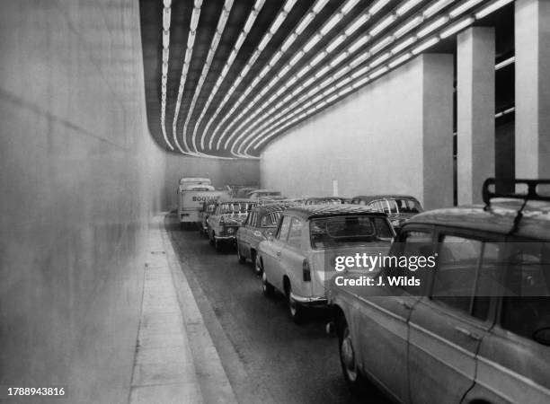 Traffic passes along the 1000-foot long underpass connecting Piccadilly with Knightsbridge, part of the Hyde Park Corner-Marble Arch Improvement...