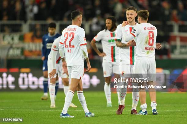 Jeffrey Gouweleeuw and Elvis Rexhbecaj of FC Augsburg shake hands after the Bundesliga match between FC Augsburg and TSG Hoffenheim at WWK-Arena on...