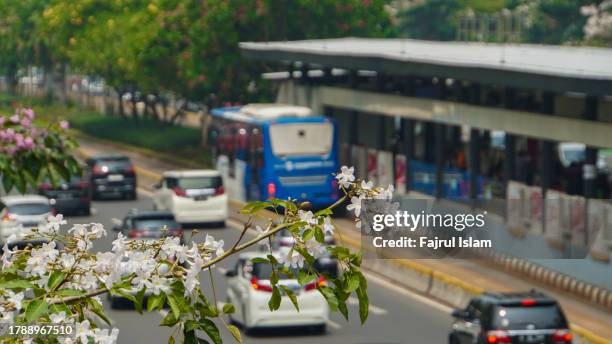 bus station in general sudirman road jakarta - sudirman stock pictures, royalty-free photos & images