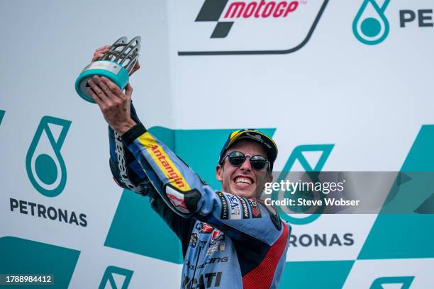 Alex Marquez of Spain and Gresini Racing MotoGP shows his trophy on the podium during the Race of the MotoGP PETRONAS Grand Prix at Sepang Circuit on...