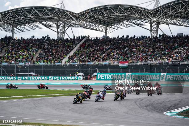 MotoGP riders on their warmup lap during the Race of the MotoGP PETRONAS Grand Prix at Sepang Circuit on November 12, 2023 in Kuala Lumpur, Malaysia.