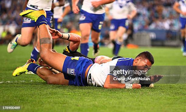 Krisnan Inu of the Bulldogs scores a try during the round 25 NRL match between the Canterbury Bulldogs and the Penrith Panthers at ANZ Stadium on...