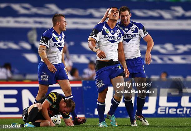 Tim Lafai of the Bulldogs is congratulated after scoring during the round 25 NRL match between the Canterbury Bulldogs and the Penrith Panthers at...