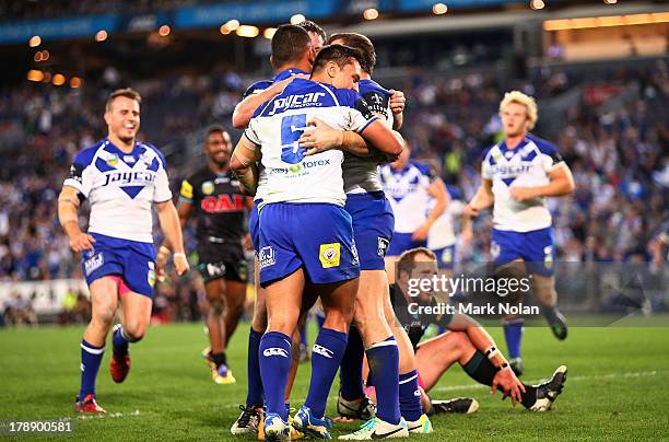 The Bulldogs celebaret a try by Krisnan Inu during the round 25 NRL match between the Canterbury Bulldogs and the Penrith Panthers at ANZ Stadium on...
