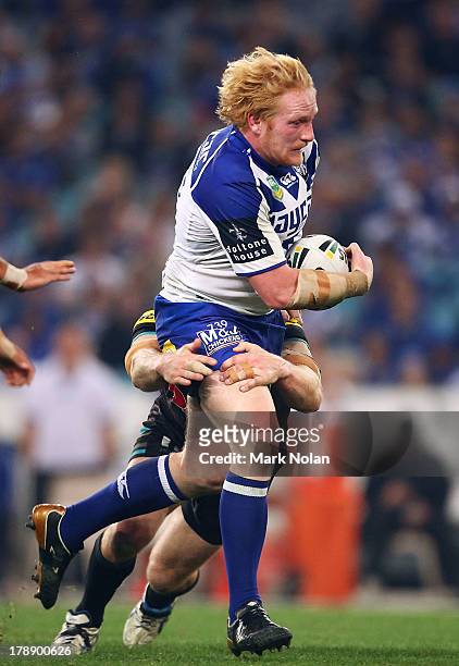 James Graham of the Bulldogs runs the ball during the round 25 NRL match between the Canterbury Bulldogs and the Penrith Panthers at ANZ Stadium on...