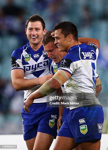 Trent Hodkinson of the Bulldogs is congratulated after scoring during the round 25 NRL match between the Canterbury Bulldogs and the Penrith Panthers...
