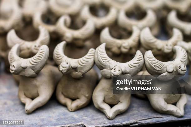 drying before firing the clay toy whistles in animal figurines - choice music group stock pictures, royalty-free photos & images
