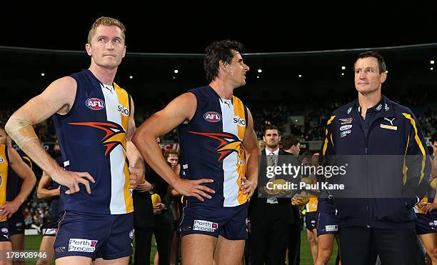 Adam Selwood, Andrew Embley and John Worsfold of the Eagles look on after the round 23 AFL match between the West Coast Eagles and the Adelaide Crows...