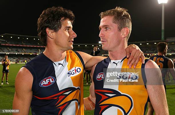 Retiring Eagles players Andrew Embley and Adam Selwood embrace after the round 23 AFL match between the West Coast Eagles and the Adelaide Crows at...