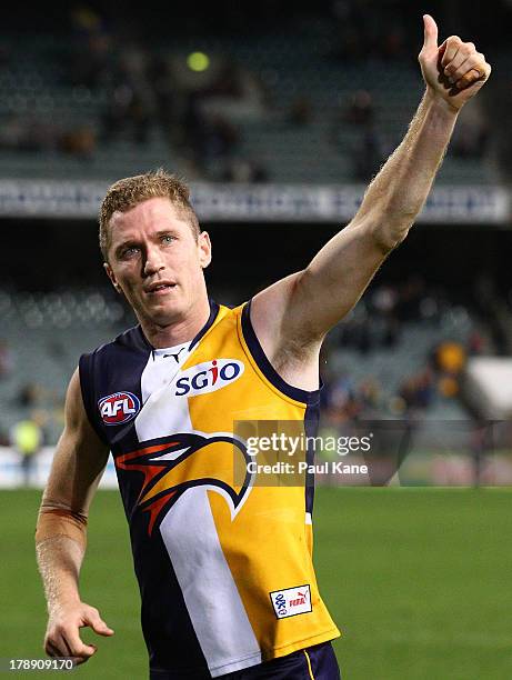 Adam Selwood of the Eagles waves to supporters after playing his final game after the round 23 AFL match between the West Coast Eagles and the...