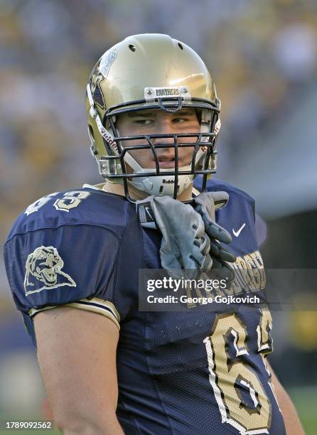 Offensive lineman Mike McGlynn of the University of Pittsburgh Panthers looks on from the field before a college football game against the Notre Dame...