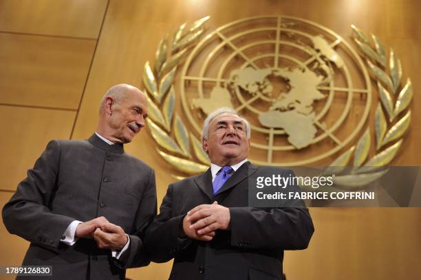 Head of the International Monetary Fund Dominique Strauss-Kahn poses next to World Trade Organisation director general Pascal Lamy prior to attend...
