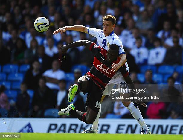 Stephen Warnock of Leeds United battles with Nedum Onuoha of Queens Park Rangers during the Sky Bet Championship match between Leeds United and...