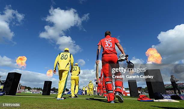 Alex Hales of England walks out alongside Fawad Ahmed of Australia during the 2nd NatWest Series T20 match between England and Australia at Emirates...
