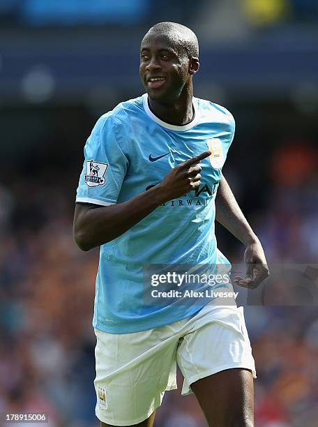 Yaya Toure of Manchester City celebrates after scoring the second goal during the Barclays Premier League match between Manchester City and Hull City...