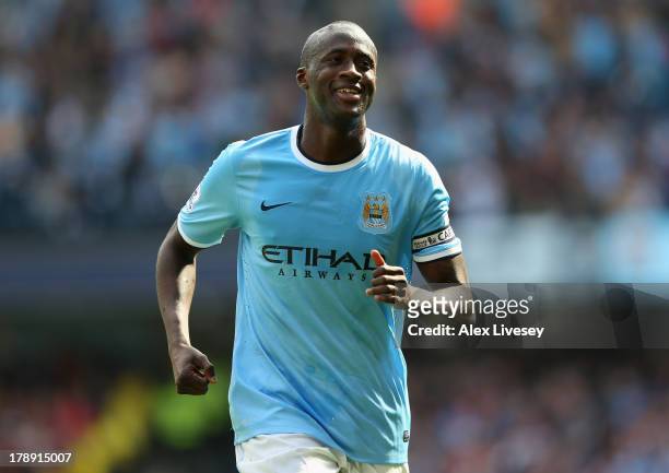 Yaya Toure of Manchester City celebrates after scoring the second goal during the Barclays Premier League match between Manchester City and Hull City...