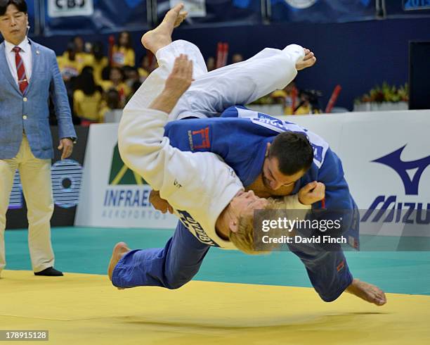 Former Olympic and World champion, Ilias Iliadis of Greece throws Joakim Dvarby of Sweden for ippon to win the u90kgs bronze medal at the Rio World...