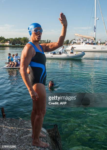 Swimmer Diana Nyad waves before attempting to swim in a three-day non-stop journey from Havana to Florida at the Ernest Hemingway Nautical Club, in...