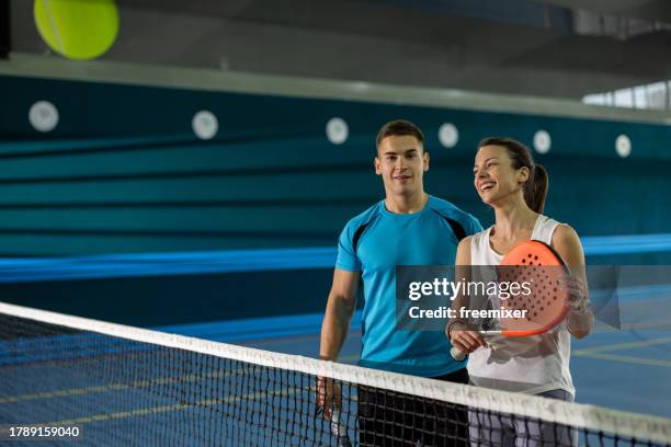 skillful players on indoor padel training - pudel stock pictures, royalty-free photos & images