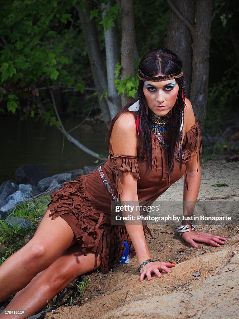 Native American woman on lake shore