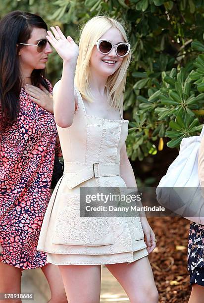 Actress Dakota Fanning waves to the crowd on day 4 of the 70th Venice International Film Festival on August 31, 2013 in Venice, Italy.