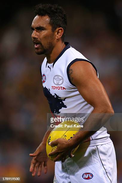 Richard Tambling of the Crows looks to pass the ball during the round 23 AFL match between the West Coast Eagles and the Adelaide Crows at Patersons...