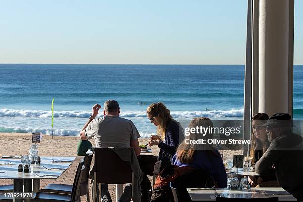 pavilion beachfront cafe maroubra beach - adult eating no face stock pictures, royalty-free photos & images