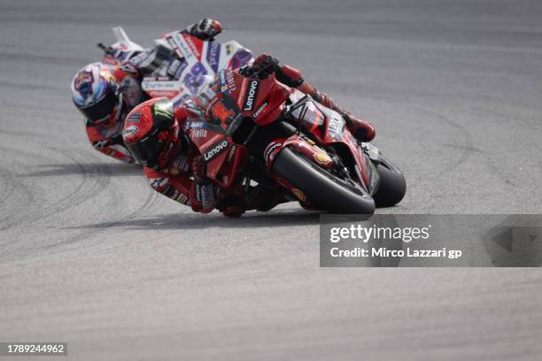 Francesco Bagnaia of Italy and Ducati Lenovo Team leads Jorge Martin of Spain and Pramac Racing during the MotoGP race during the MotoGP of Malaysia...
