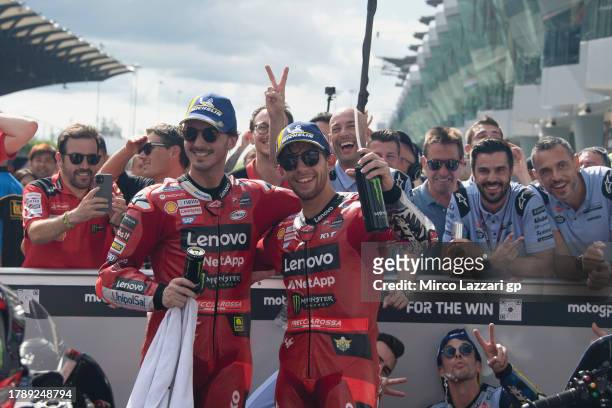 Francesco Bagnaia of Italy and Ducati Lenovo Team and Enea Bastianini of Italy and Ducati Lenovo Team celebrate under the podium during the MotoGP...