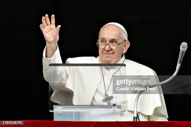 Pope Francis greets pilgrims and visitors during the recitation of the midday Angelus prayer at St. Peter's Square on November 12, 2023 in Vatican...