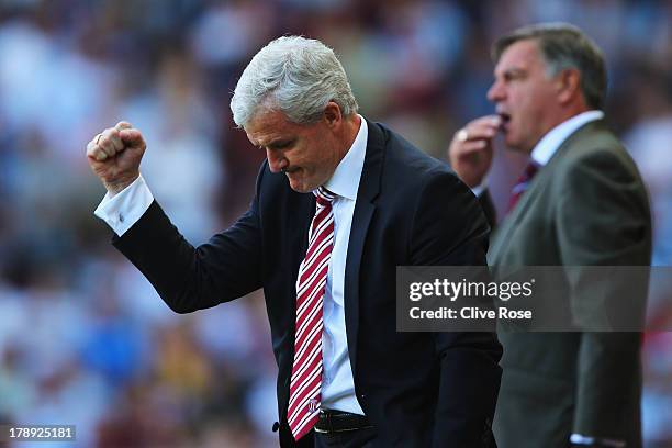 Stoke City manager Mark Hughes reacts during the Barclays Premier League match between West Ham United and Stoke City at the Bolyen Ground on August...