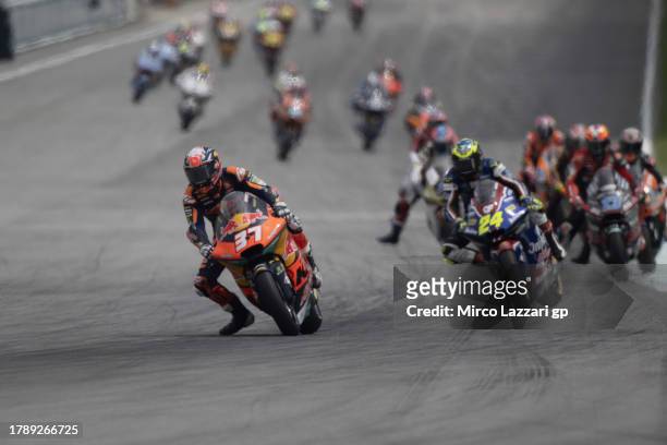 Pedro Acosta of Spain and Red Bull KTM Ajo leads the field during the Moto2 race during the MotoGP of Malaysia - Race at Sepang Circuit on November...