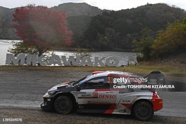 Elfyn Evans and his co-driver Scott Martin of Great Britain drive their Toyota GR Yaris Rally1 Hybrid at the SS14 Lake Mikawako section of the Rally...