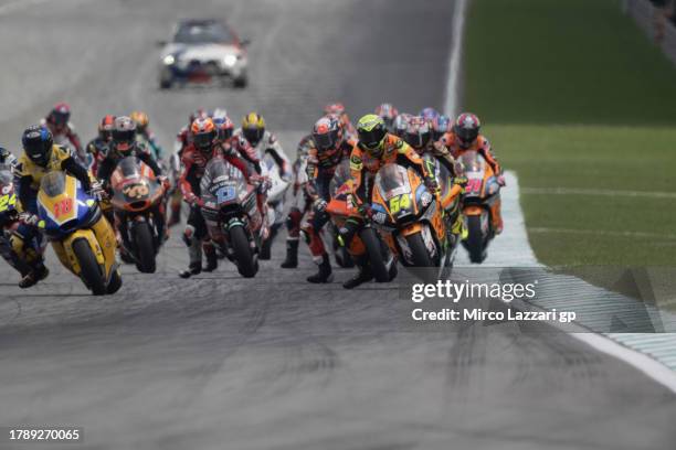 The Moto2 riders start from the grid during the Moto2 race during the MotoGP of Malaysia - Race at Sepang Circuit on November 12, 2023 in Kuala...