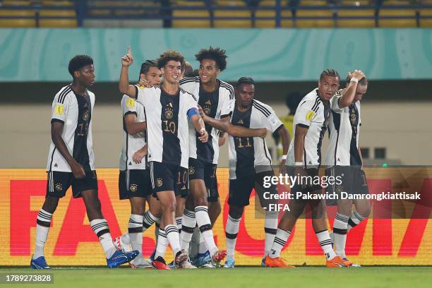 Noah Darvich of Germany celebrates with teammates after scoring the team's first goal during the FIFA U-17 World Cup Group E match between Mexico and...