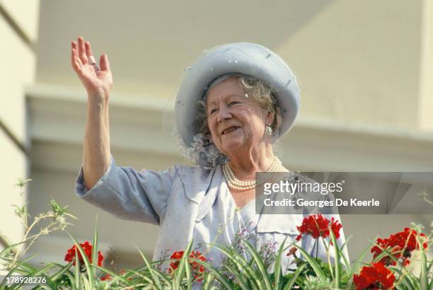 The Queen Mother waves to well-wishers during the celebration of her 90th birthday on August 4, 1990 in London, England.