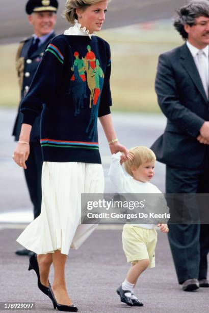 Diana, Princess of Wales, and her young sons Prince William and Prince Harry arrive at Aberdeen Airport for the start of their holidays in Scotland...