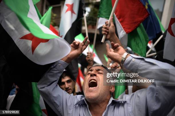 Syrian immigrant living in Bulgaria shouts slogans against the regime of Syrian President Bashar Al-Assad on August 31 during a demonstration in...