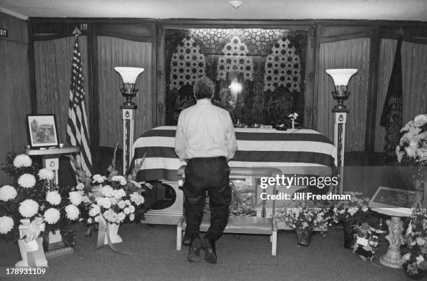 The coffin of beloved 'Back Fence Bar' barman, Alsky, at the Nucciarone Funeral Home, Sullivan Street, Greenwich Village, New York City, circa 1975.