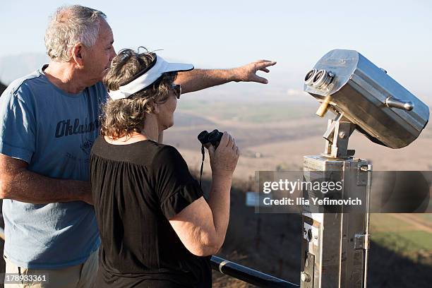 Tourist overviewing the Israeli Syrian border from Mount Bental near Kibutz Merom Golan on August 31, 2013 in the Israeli-annexed Golan Heights....