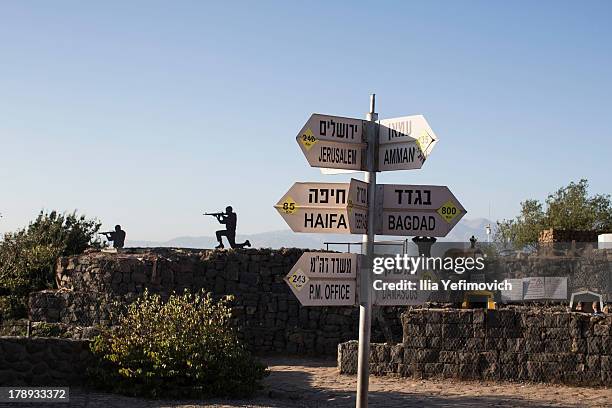 Road sign shows the different distances to Jerusalem, Baghdad, Damascus and other locations at an army post in Mount Bental near Kibutz Merom Golan...