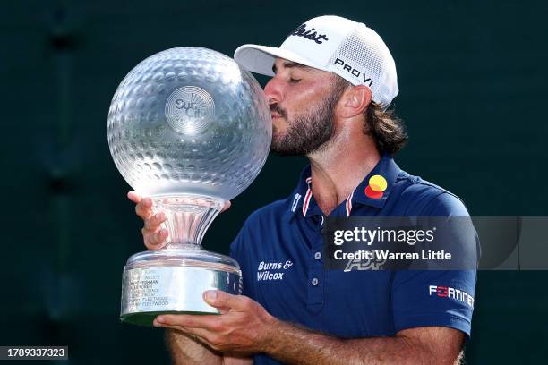 Max Homa of the United States holds the trophy as he celebrates victory after winning the tournament during Day Four of the Nedbank Golf Challenge at...