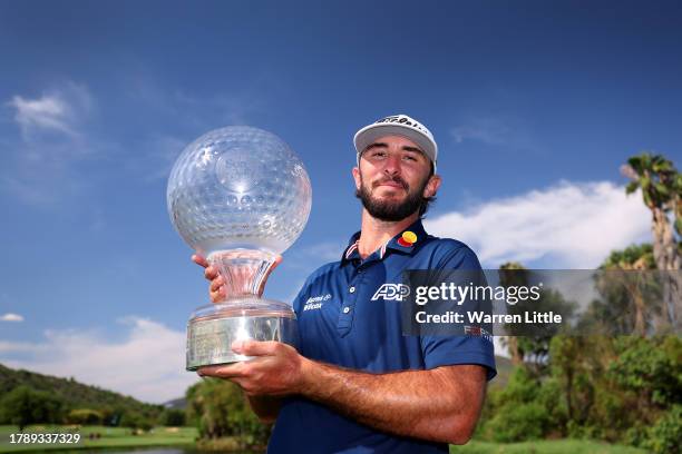 Max Homa of the United States holds the trophy as he celebrates victory after winning the tournament during Day Four of the Nedbank Golf Challenge at...